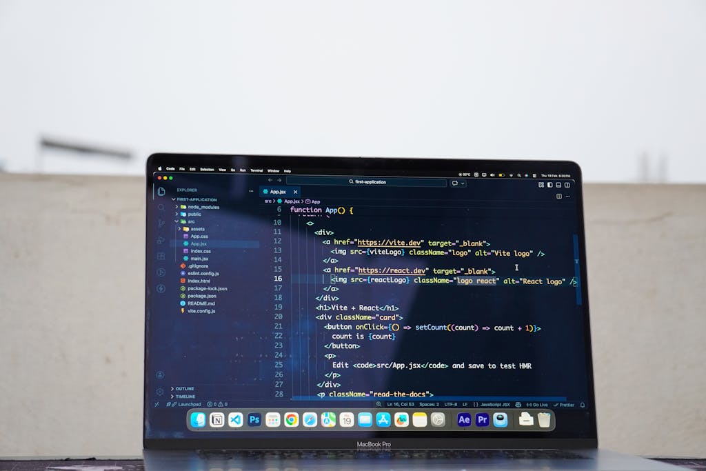 Laptop displaying code outdoors, ideal for remote work or freelance programming.